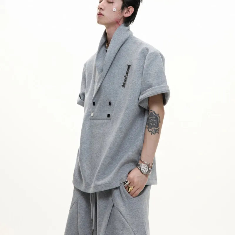 Men's dark cotton sports suit with padded shoulder V-neck top and matching shorts with metal embellishments