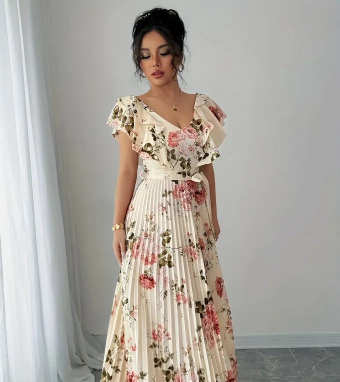 Apricot colour dress with digital floral print, V-neck, ruffled short sleeves, and a high-waisted oversized swing skirt.