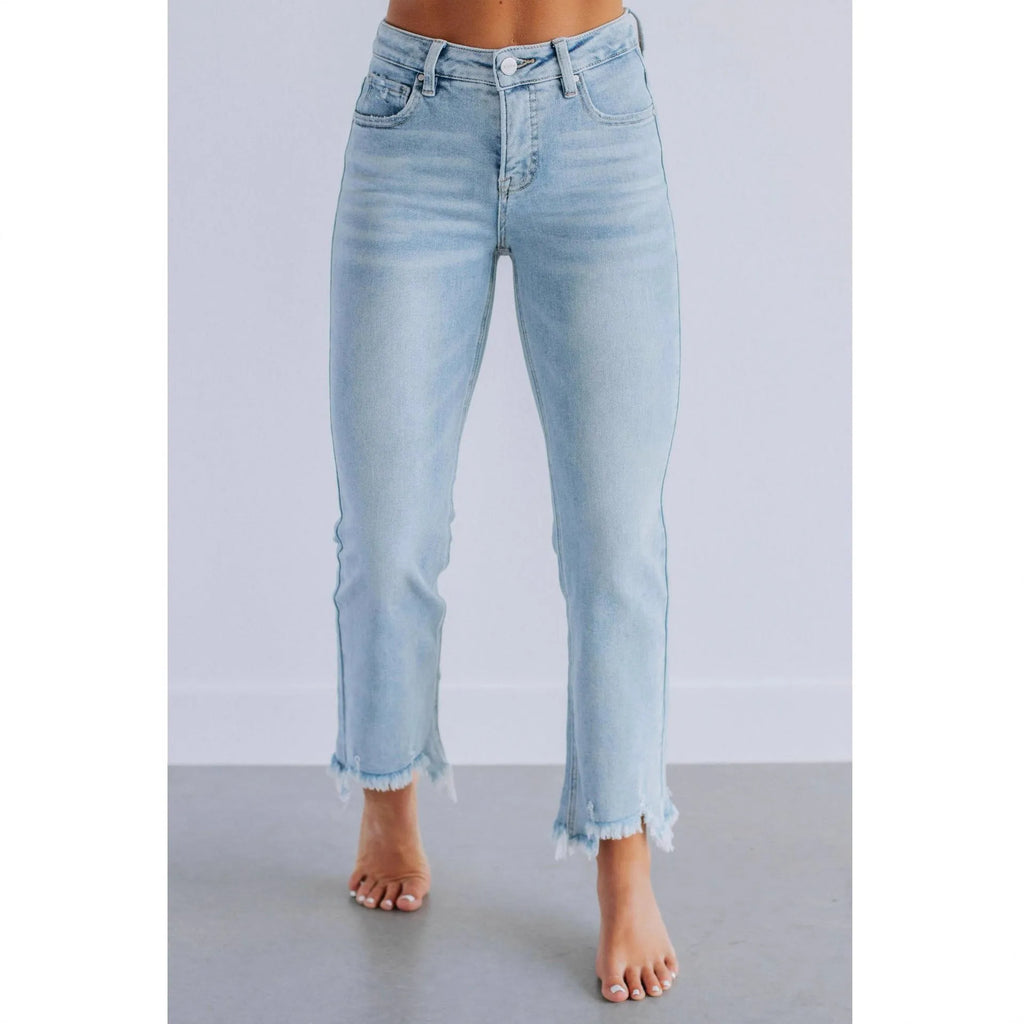 Women's solid colour denim jeans in dark blue or light blue, made from cotton fabric.