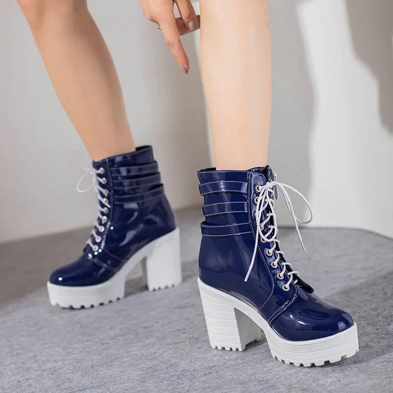 Women's black lace-up platform ankle boots with a round toe and a thick rubber sole.