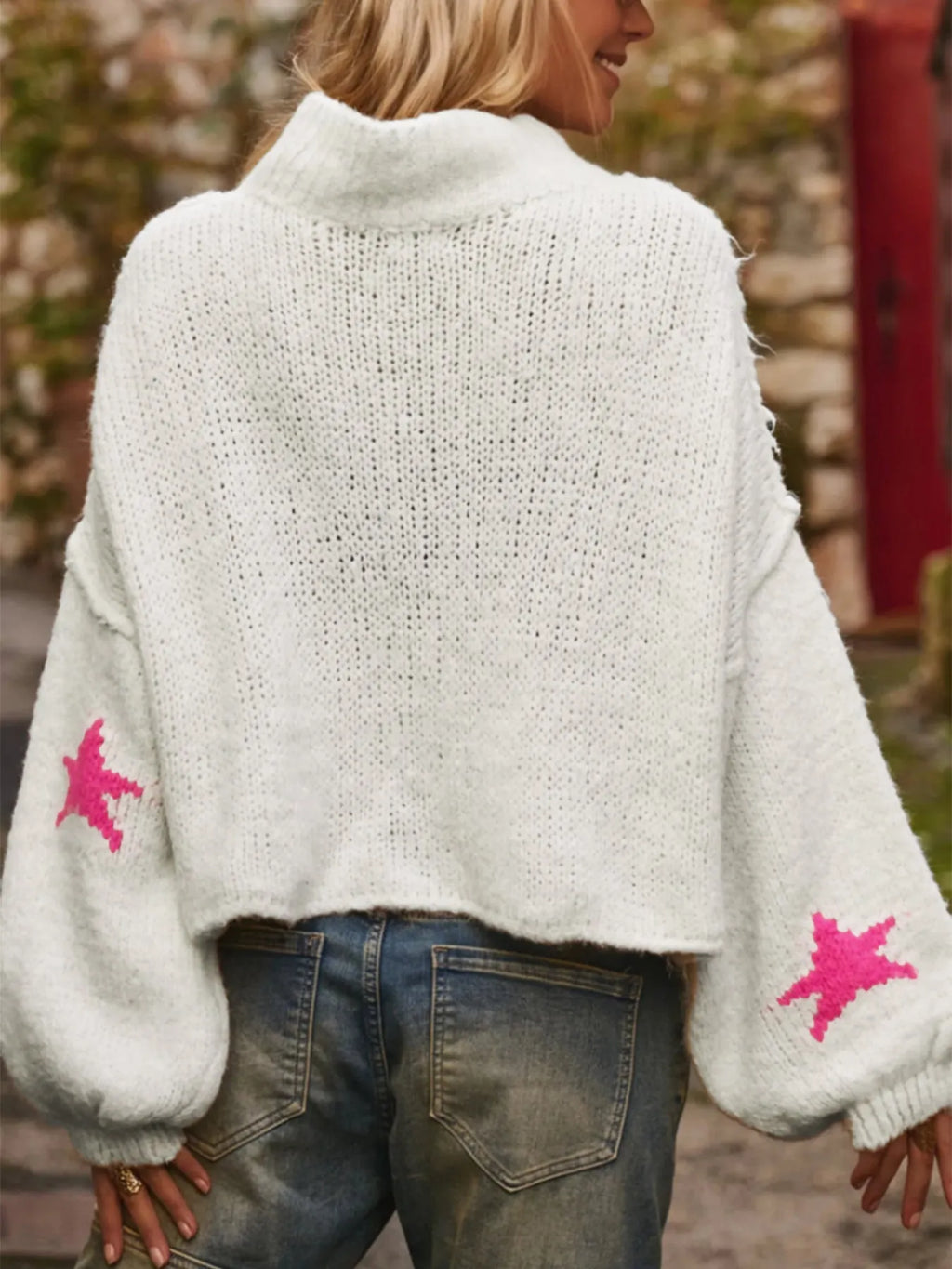 White women's loose turtleneck pullover sweater with five-pointed star pattern and contrast detailing