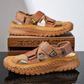Men's grey genuine leather sandals with mesh lining and an elastic band on a rubber sole.