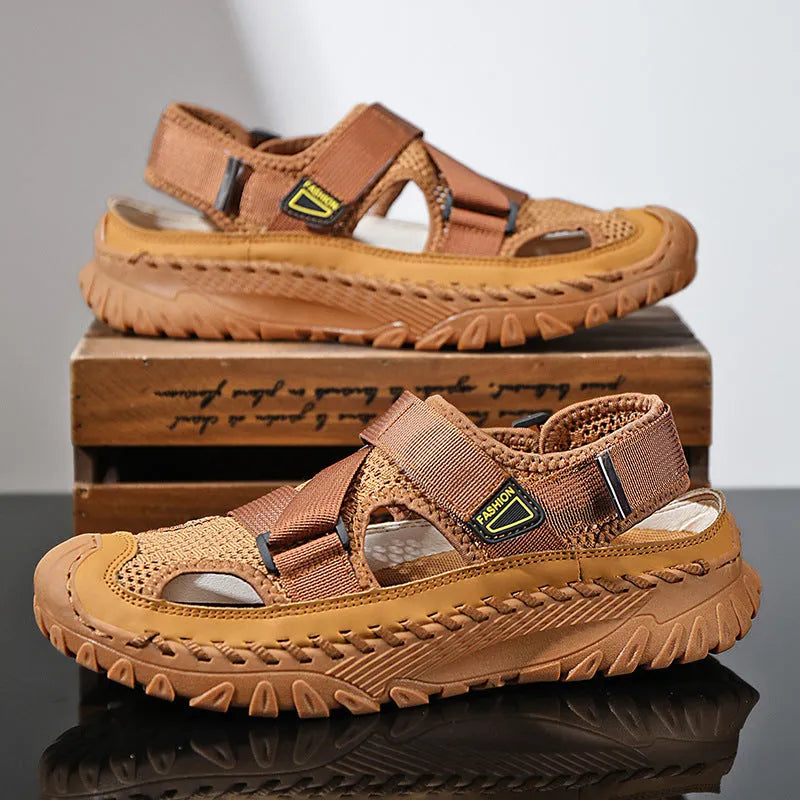 Men's grey genuine leather sandals with mesh lining and an elastic band on a rubber sole.