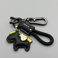Zinc alloy car keychain pendant with a strap made of brown cowhide and green flannel rope.