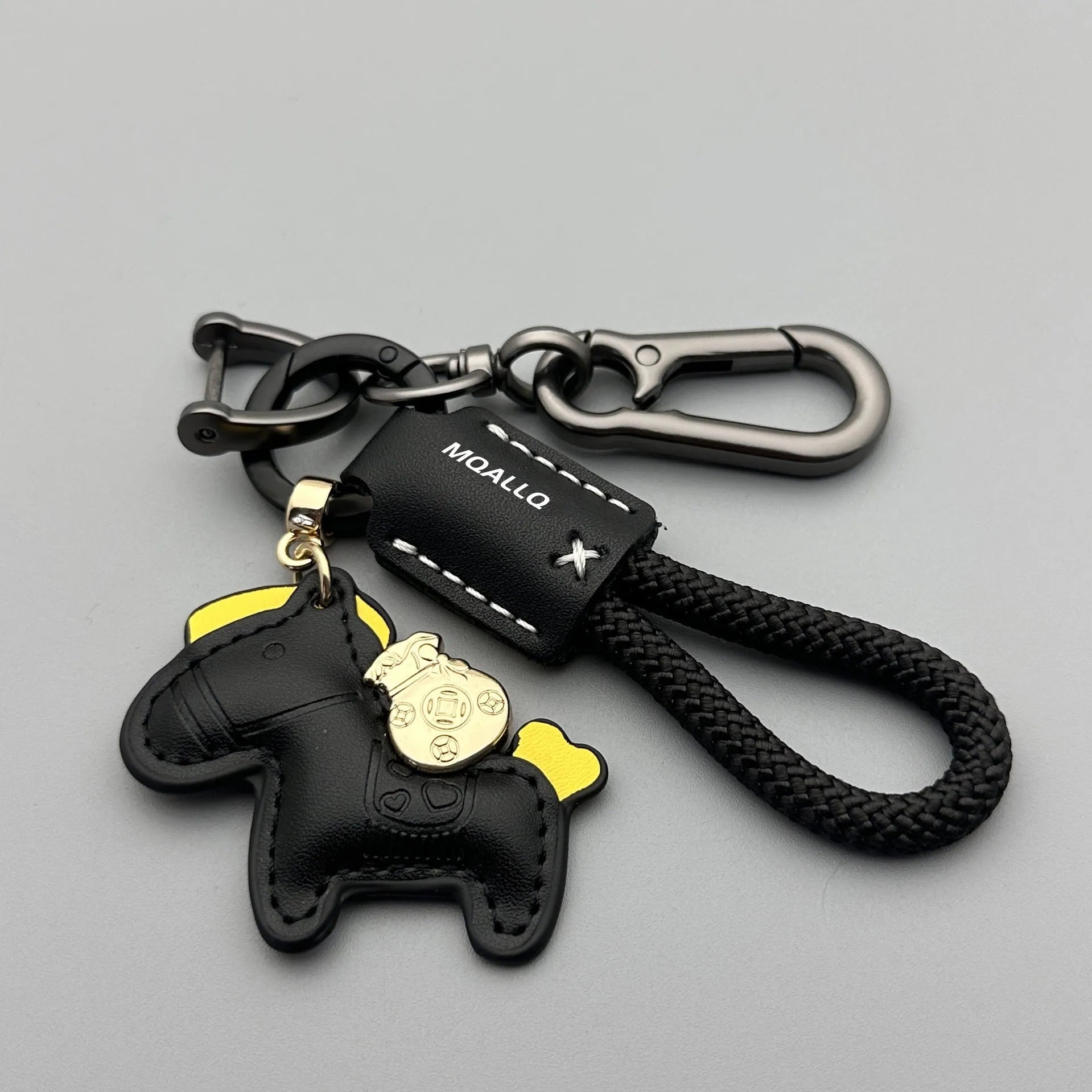 Zinc alloy car keychain pendant with a strap made of brown cowhide and green flannel rope.