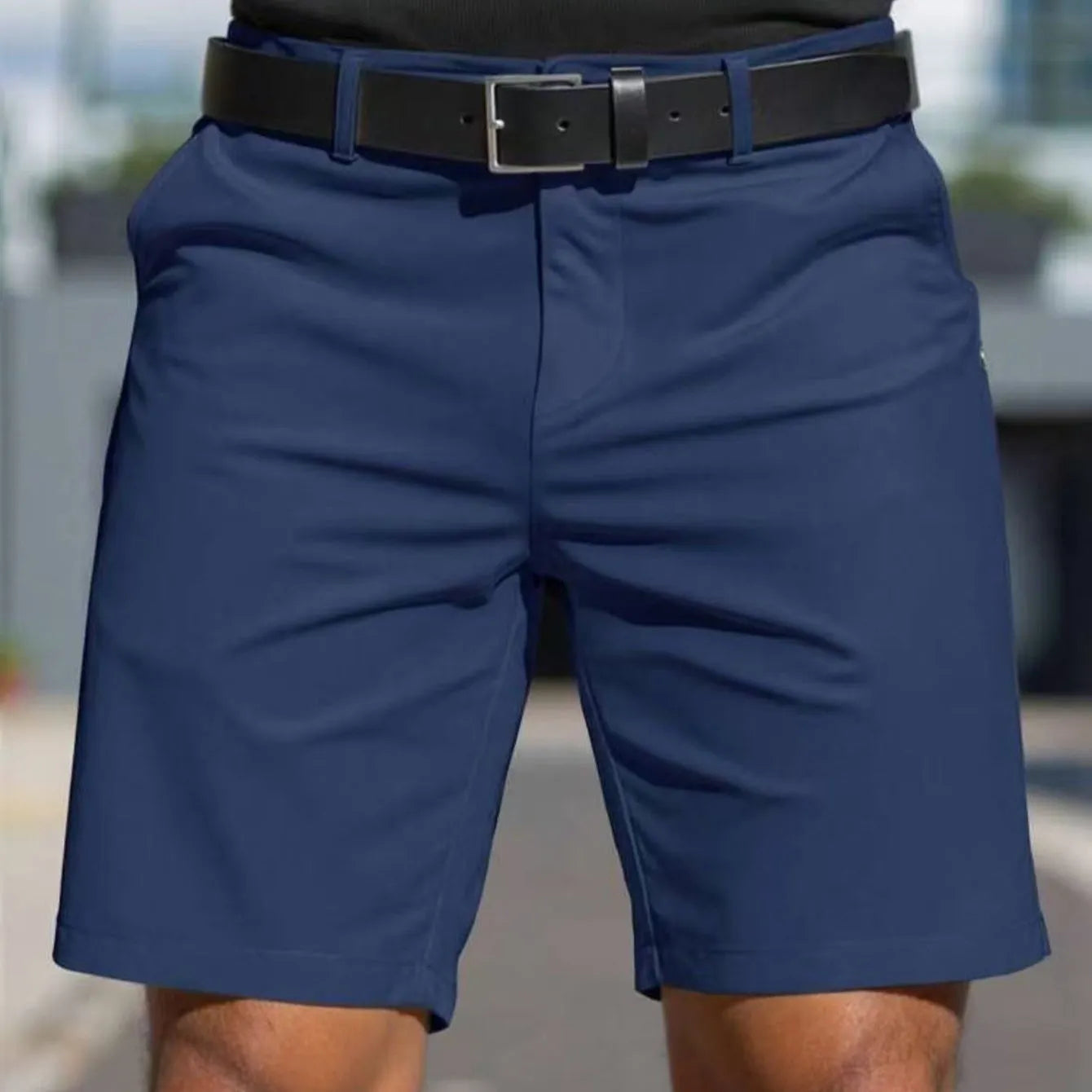 Men's straight cut solid colour shorts in light blue, showing fifth pants length and micro elastic polyester fabric.
