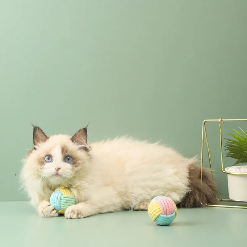 Handmade cotton cat hairball plush toy in blue-pink, green-blue, or pink-green colours, 5cm in diameter.