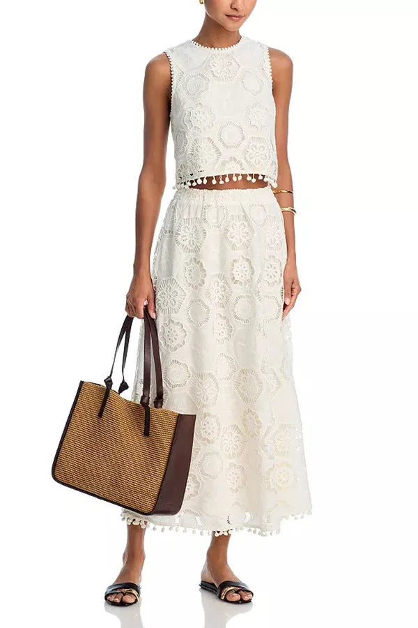 White women's polyester two-piece suit with embroidered retro art design, featuring sleeveless top and long skirt