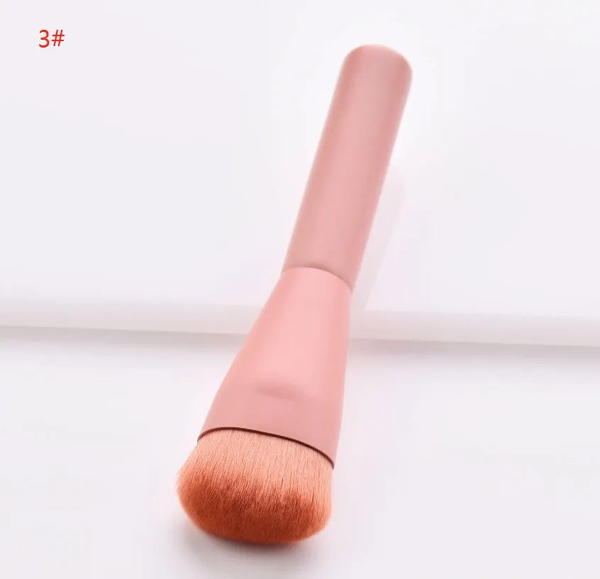 Ten professional makeup brushes with wooden handles arranged by size for different cosmetic applications