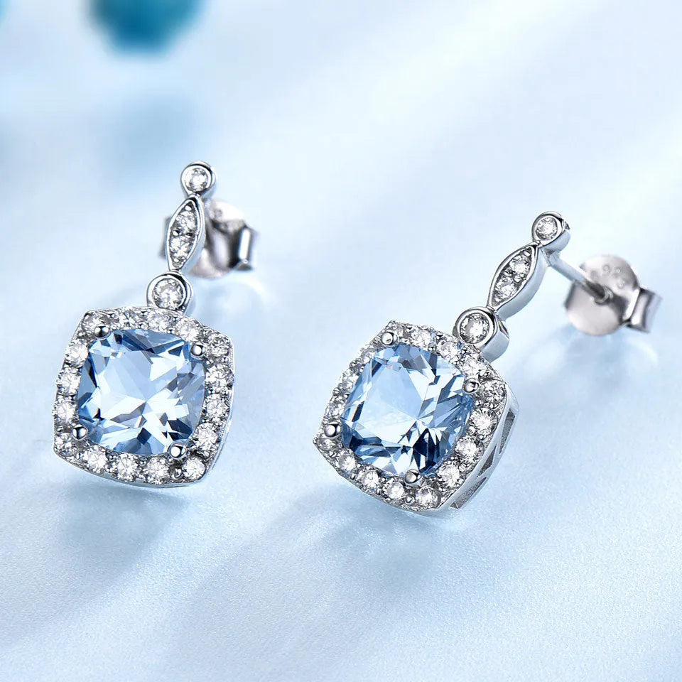 925 sterling silver jewellery set with sky blue topaz stones, including necklace, bracelet and earrings
