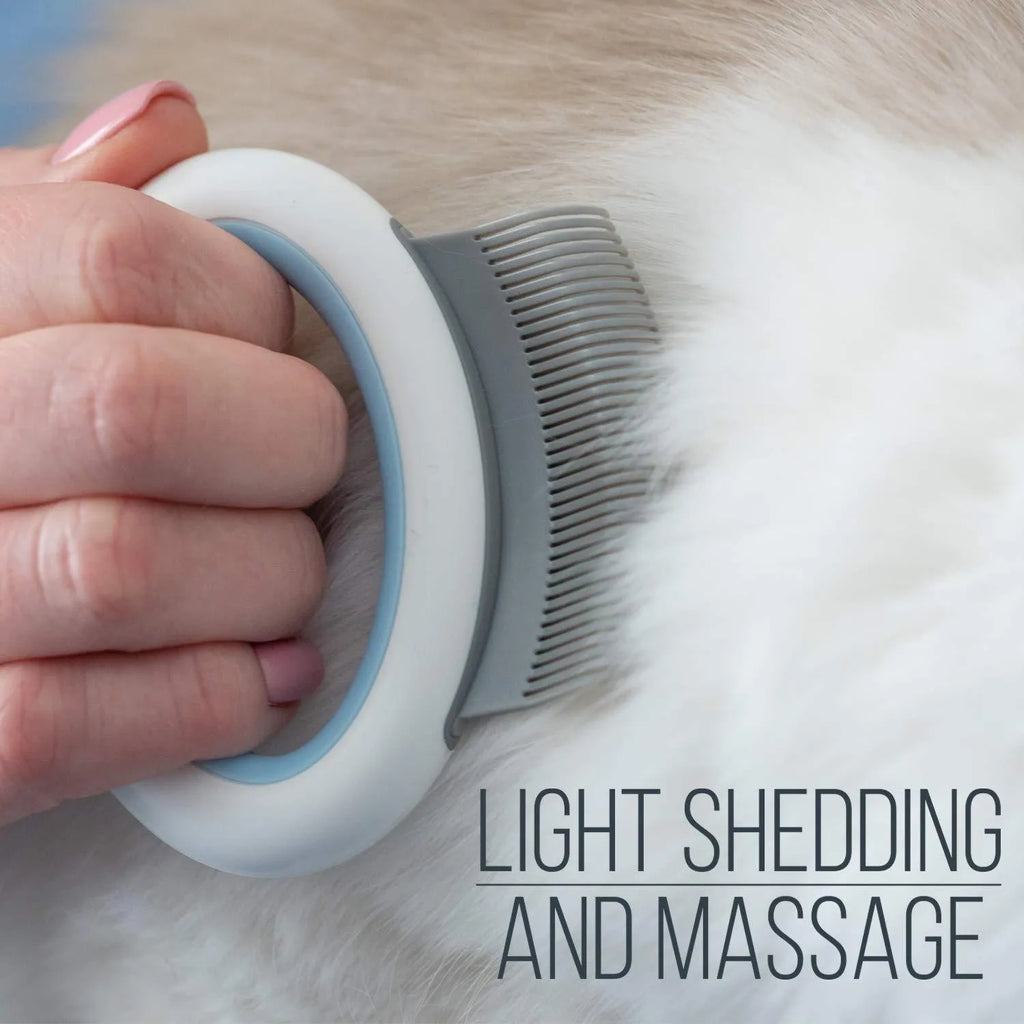 Blue plastic pet grooming comb for deshedding and dematting cat and dog hair on a white background.