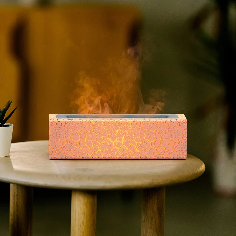 Square black creative lava flame USB desktop humidifier and essential oil diffuser on a desk.