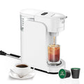 Black and white compact capsule coffee machine with adjustable stainless steel drip tray and transparent water tank.