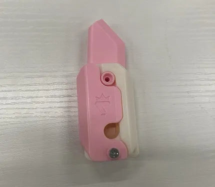 Carrot-shaped 3D printed plastic gravity fidget knife with orange purple green colour scheme
