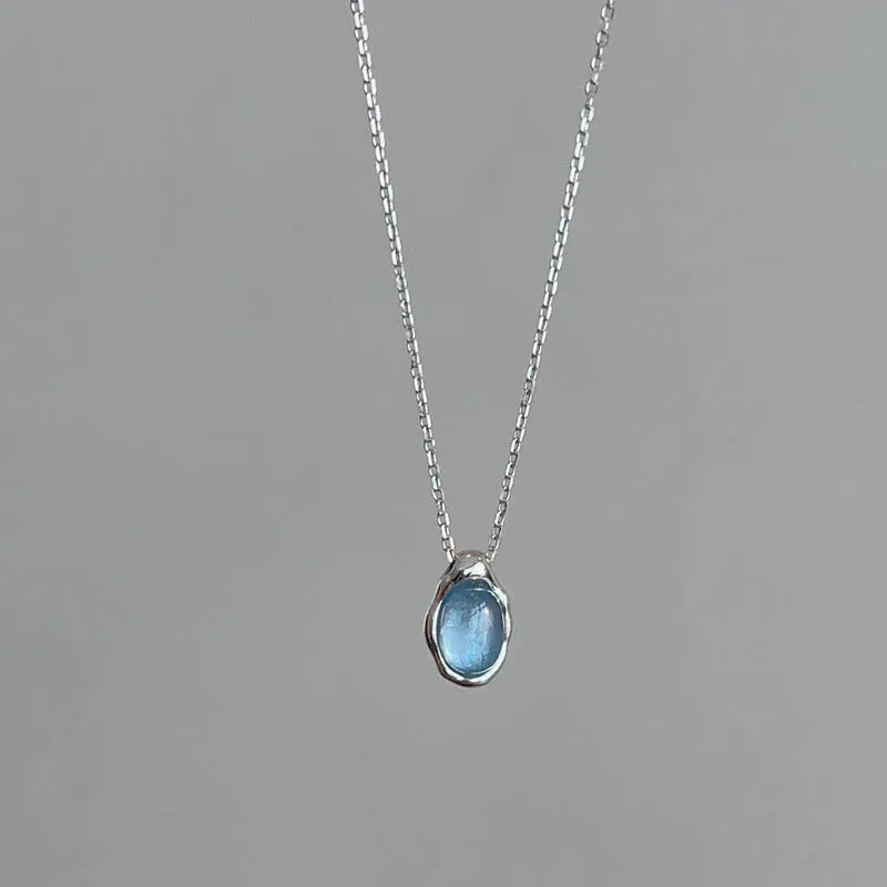Navy blue water drop pendant necklace with geometric copper pendant on adjustable chain