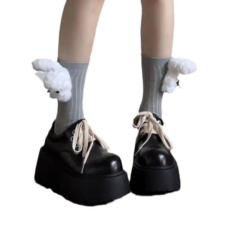 Women's matte black retro platform shoes with chunky rubber sole and lace-up buckle.