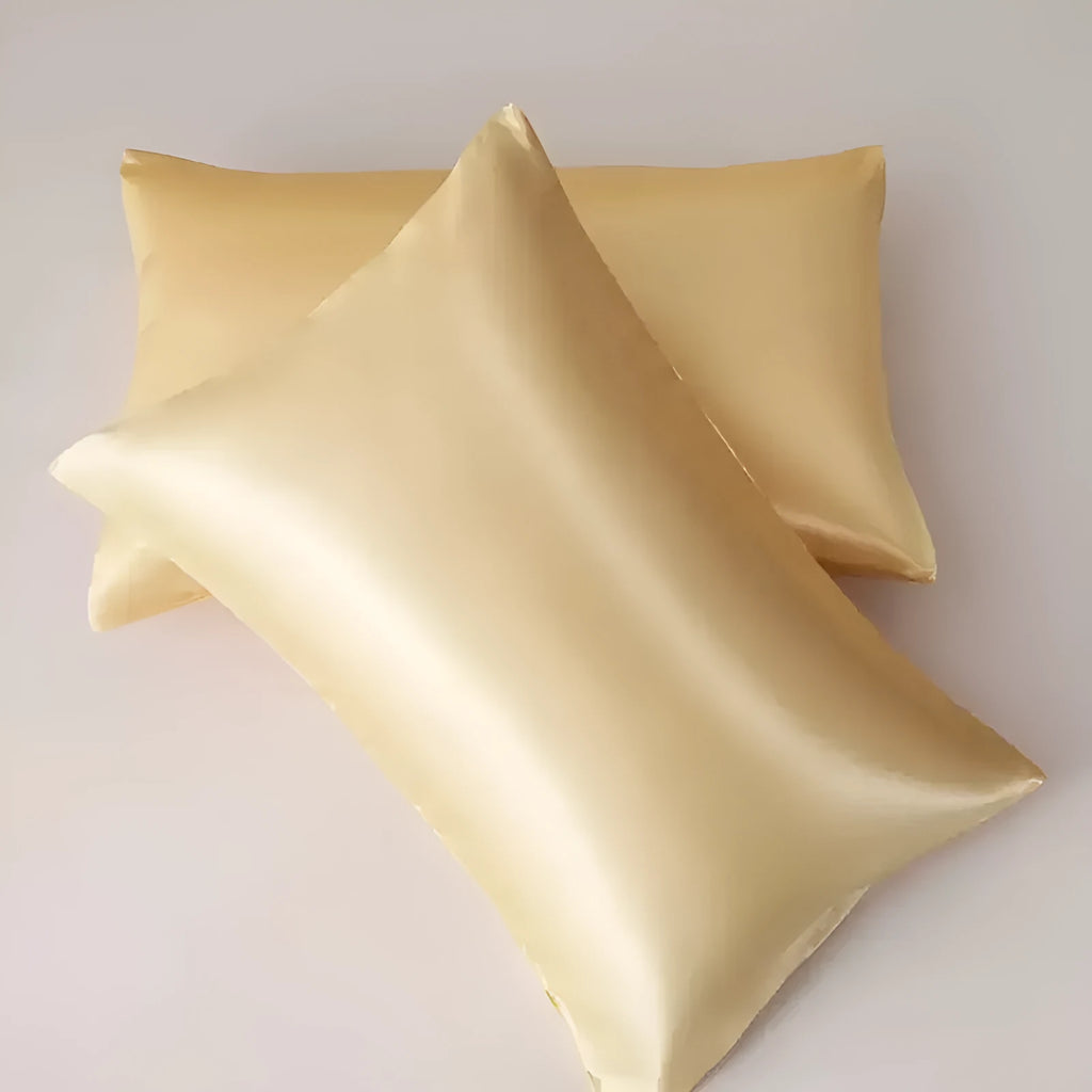 A pair of solid colour satin pillowcases in a chosen shade, shown flat to display size and plain weave texture.