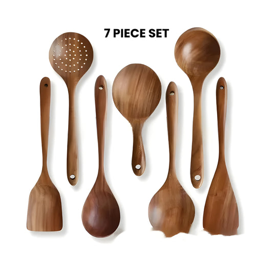 7-piece wooden kitchen utensil set showing four different spoon and spatula designs on a kitchen surface