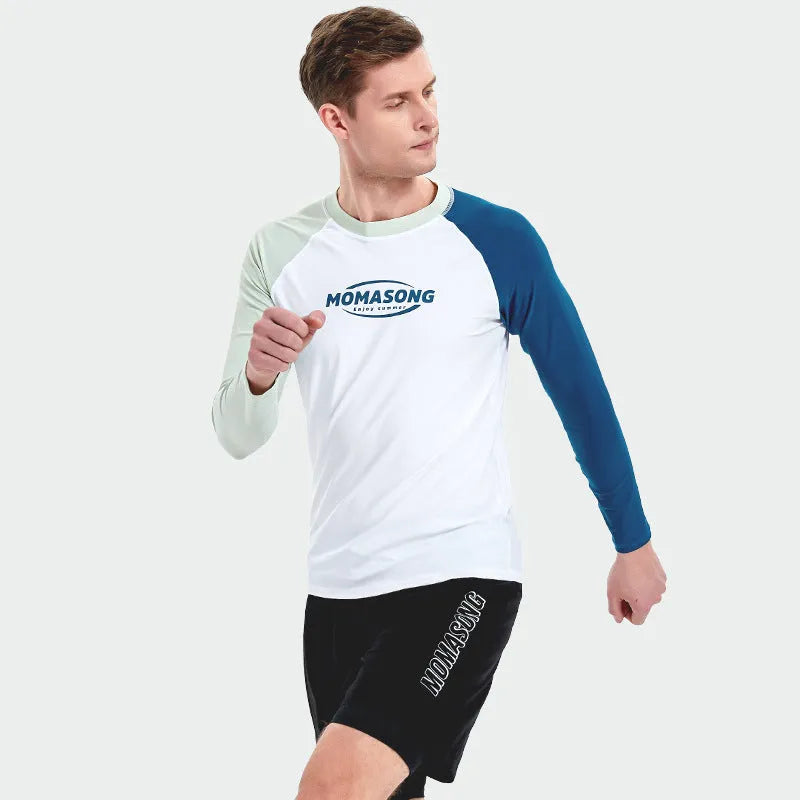 Men's white long-sleeved swim top with matching blue double-layer swim trunks on a beach.