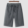Men's loose-fit linen shorts in a cropped mid-length style with an elastic waistband.