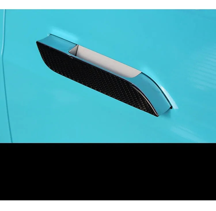 Set of four plain carbon fibre adhesive protection stickers for Tesla Model S door handles.