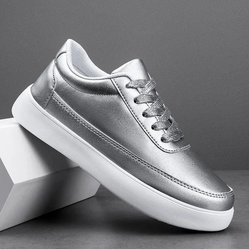 Women's gold leather lace-up casual flat shoes with a flat heel on a white background.