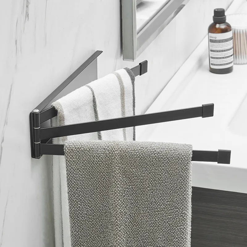 Black folding towel bar with adhesive installation for a no-drill bathroom fit.