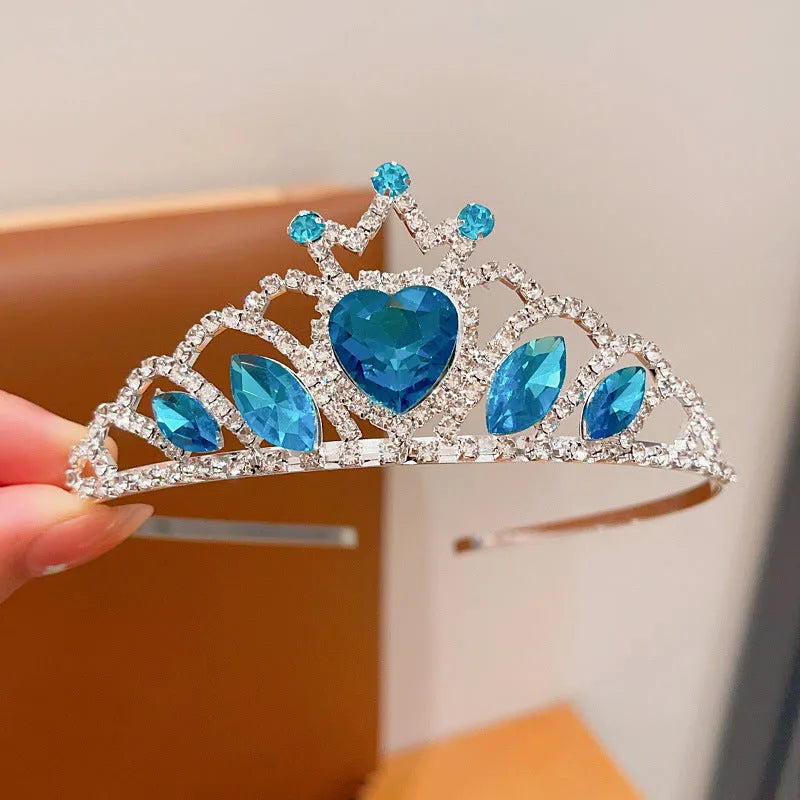 Children's electroplated alloy metal headband with crown shape and crystal decoration in pink, blue, or purple.