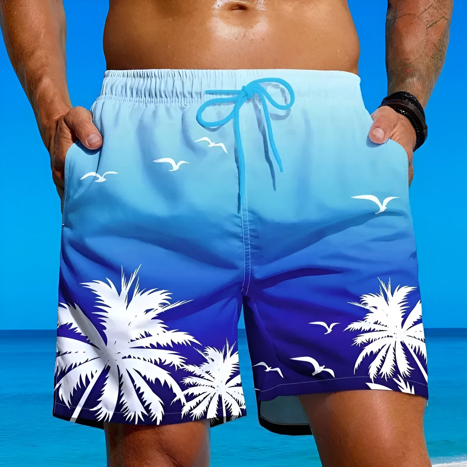 Men's loose board swimming trunks in an ethnic style, made from blue polyester fabric, shown on a size chart.