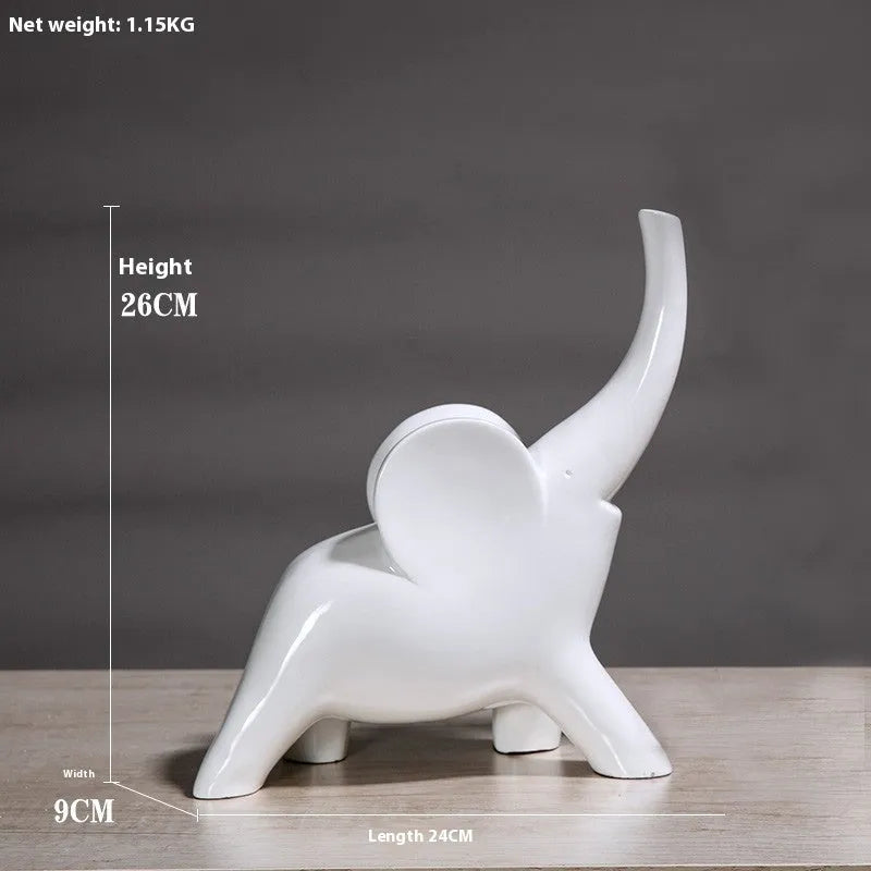 Modern minimalist solid resin elephant ornament in rose gold or white finish on a shelf.