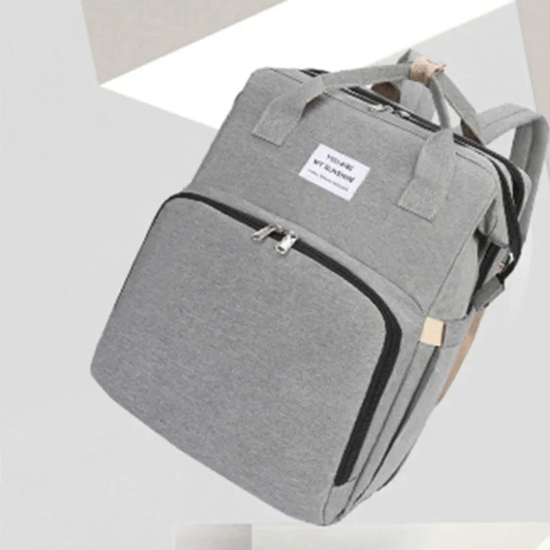 Portable lightweight nylon folding baby changing bag with USB port and shoulder strap in selected colour.