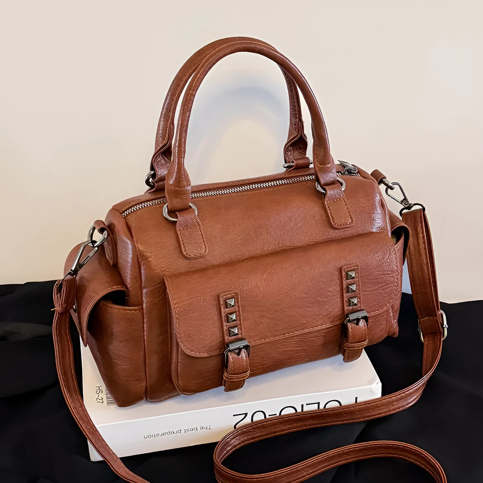 Vintage-style large square messenger bag in PU leather with contrast stitching.