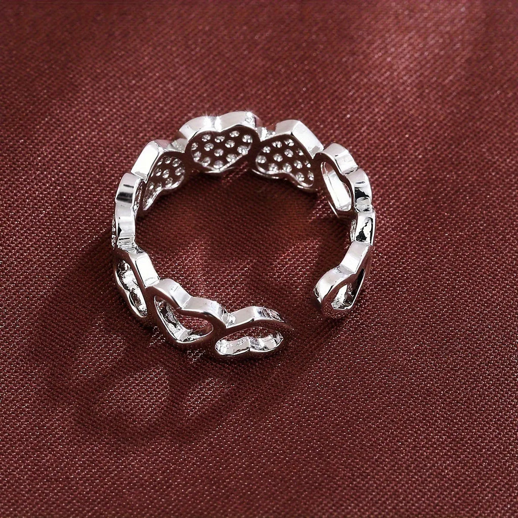 Adjustable geometric love heart couples ring in gold colour on small finger