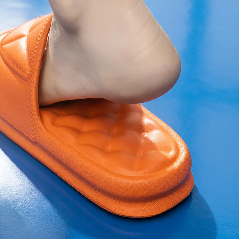 A pair of soft EVA bathroom slippers with a thick non-slip sole, shown in available colours.