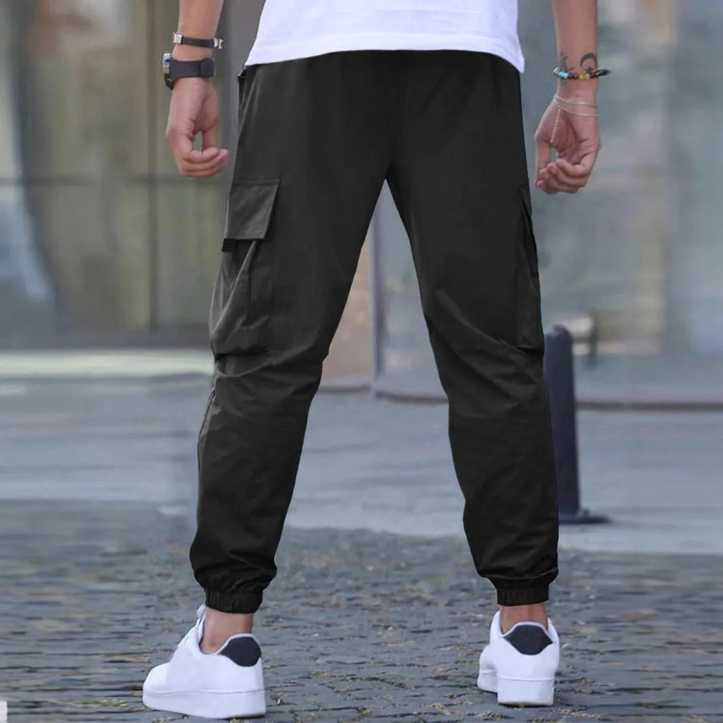 Workwear casual pants with drawstring elastic waist, solid colour, polyester fibre, skinny leg, black colour option