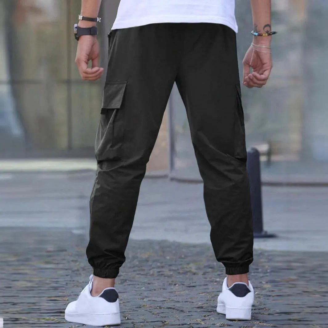 Workwear casual pants with drawstring elastic waist, solid colour, polyester fibre, skinny leg, black colour option