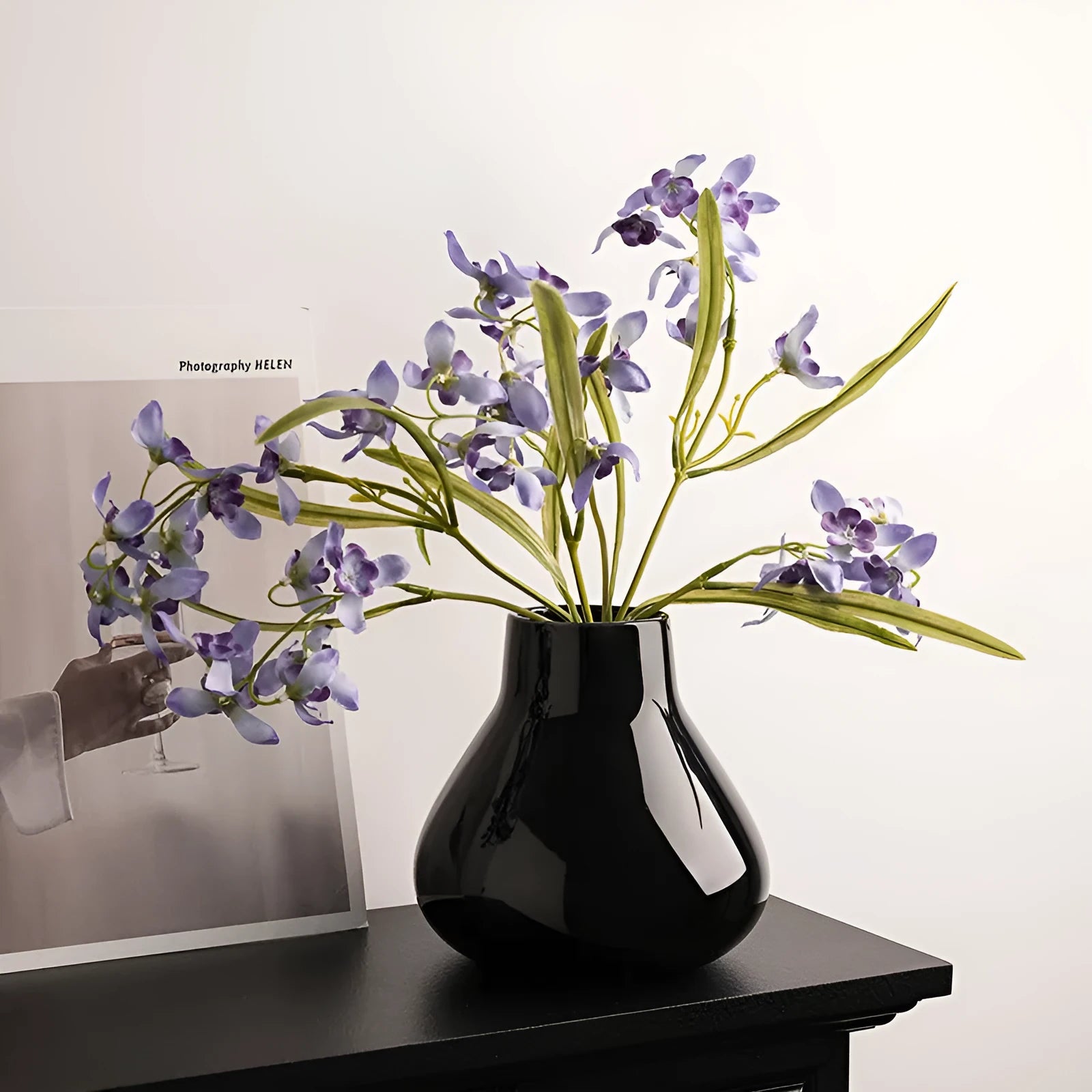 Ceramic decorative vase with artificial flowers in black or white modern design