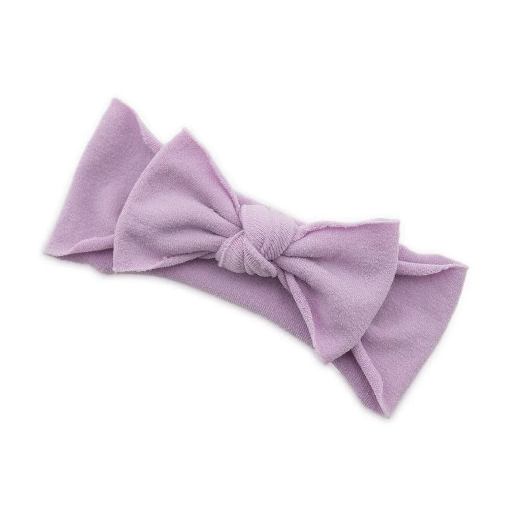 Solid colour knotted cloth headband for baby girls with bowknot design, available in 37 colours