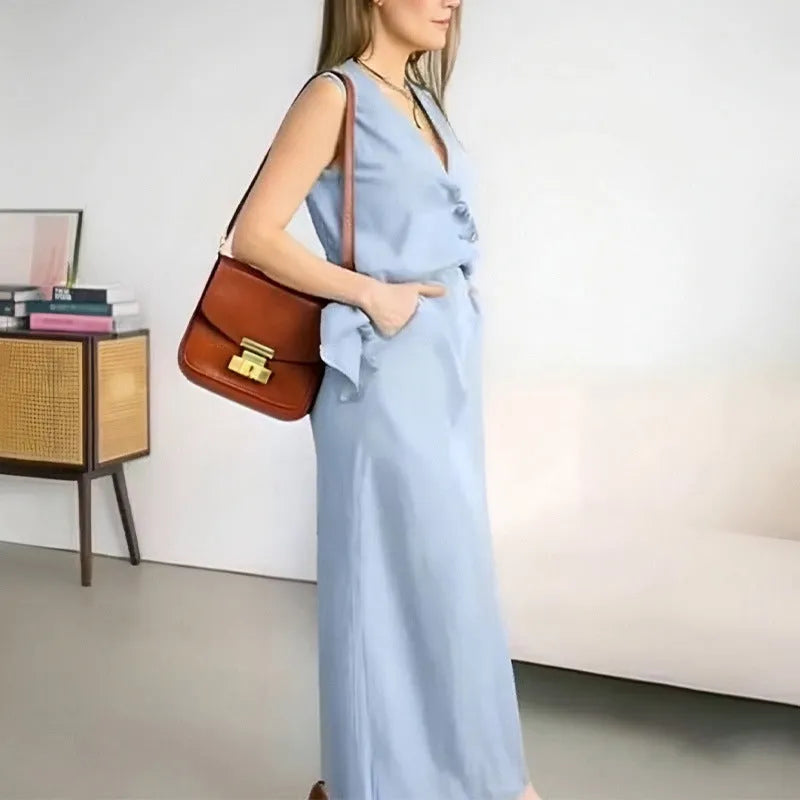 Women's blue casual two-piece set with sleeveless vest top and long skirt on hanger
