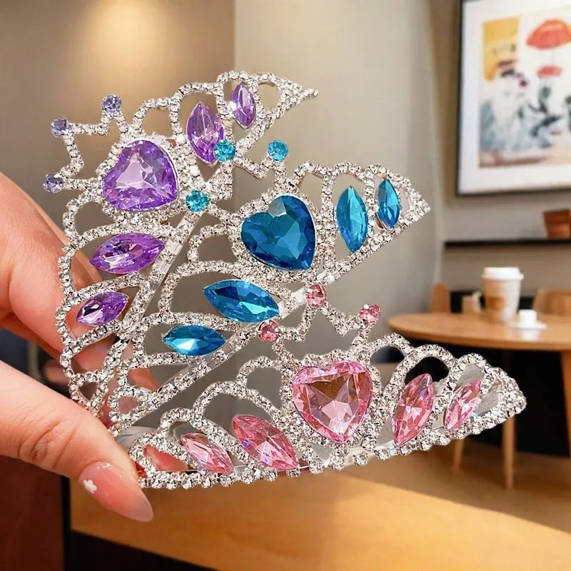 Children's electroplated alloy metal headband with crown shape and crystal decoration in pink, blue, or purple.