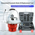 Pneumatic brake fluid replacement machine with large tank, pressure gauge, and regulator on a workshop bench.