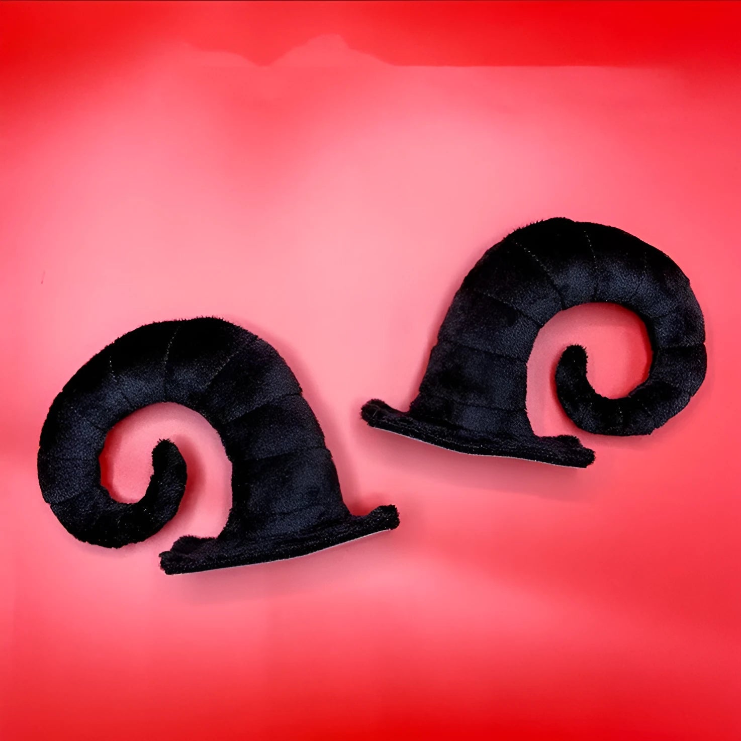 Pair of composite fibre demon horn ornaments for motorcycle helmet customisation in four colour options.