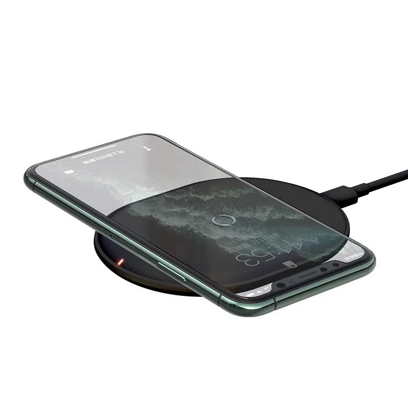 Black wireless charging pad with textured surface and indicator light for mobile phones