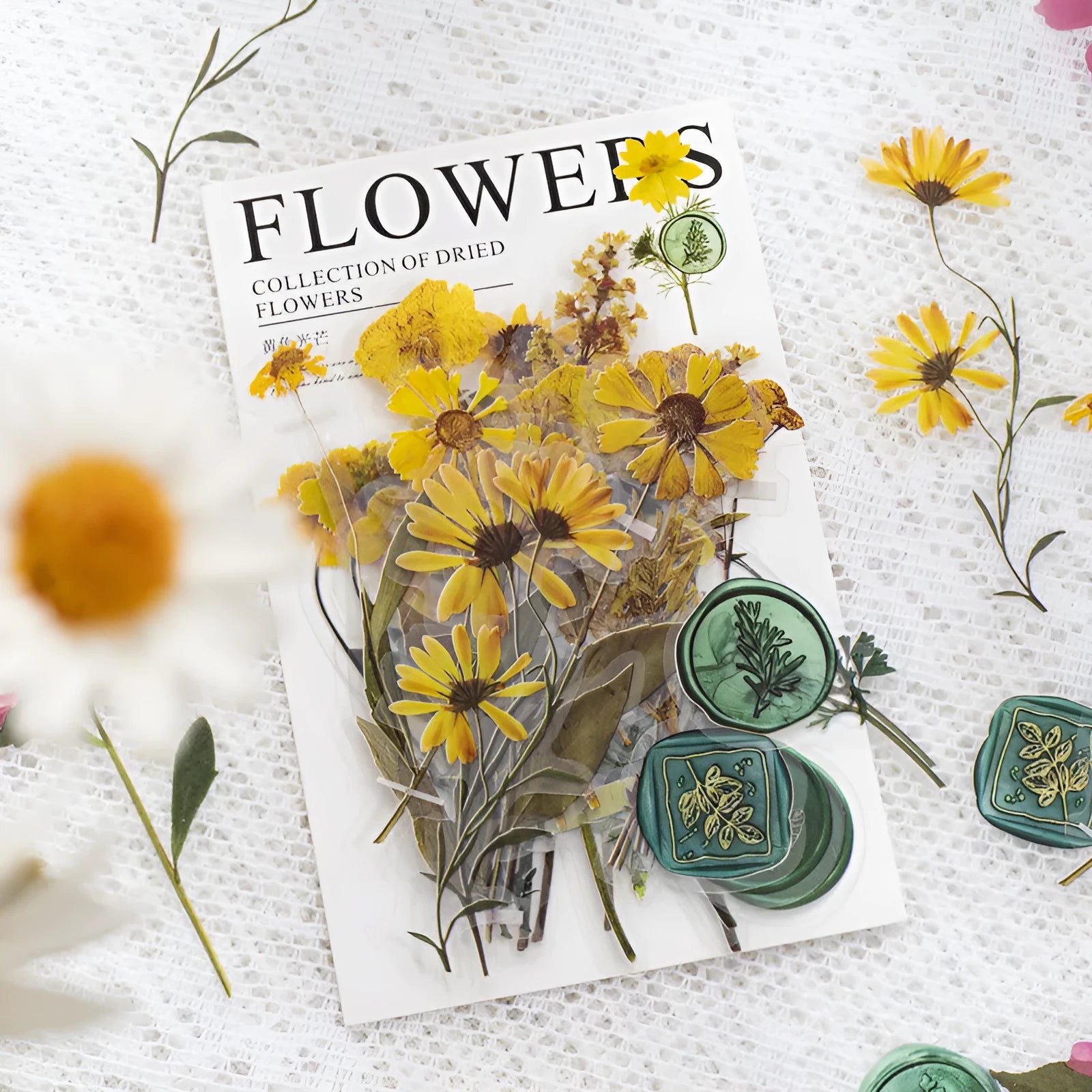 Pack of 40 decorative dried flower design sticker sheets in eight colours including purple, blue, and orange.