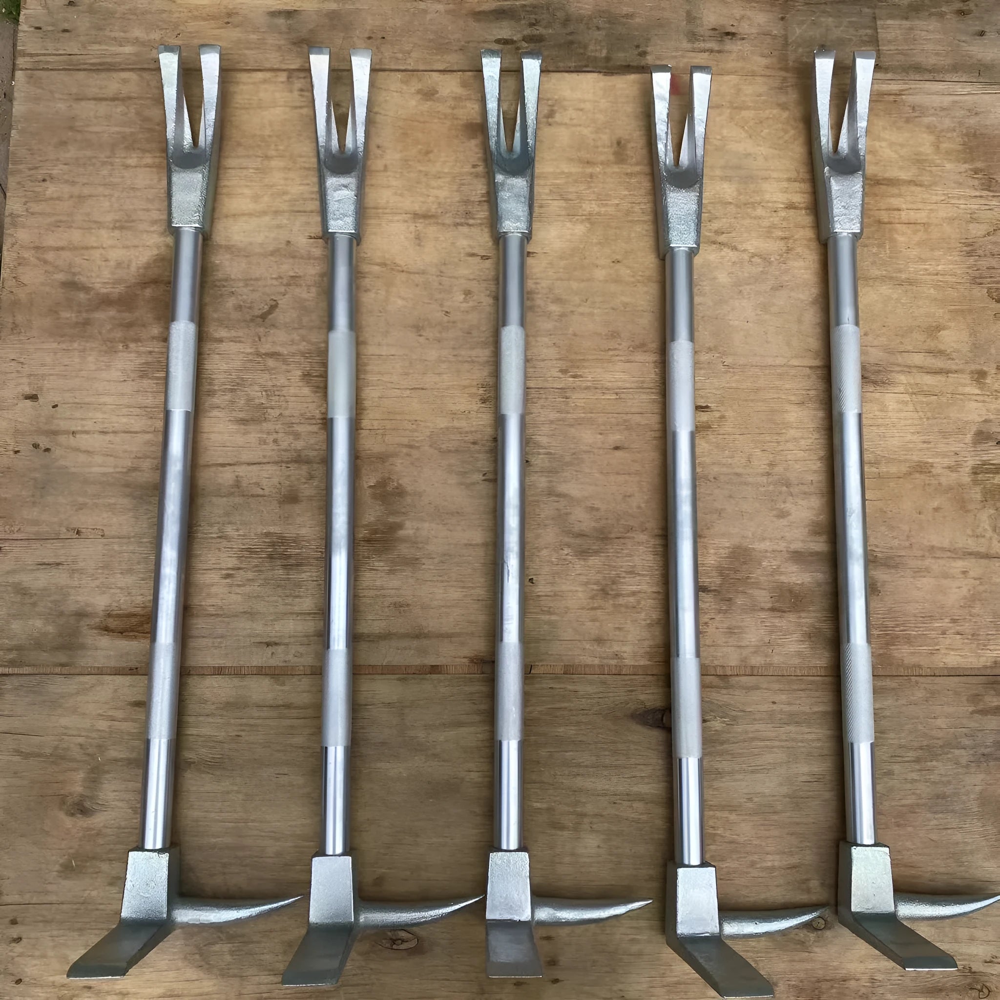 Silver carbon steel wrecking bar 24 inches with iron collar on a dark surface
