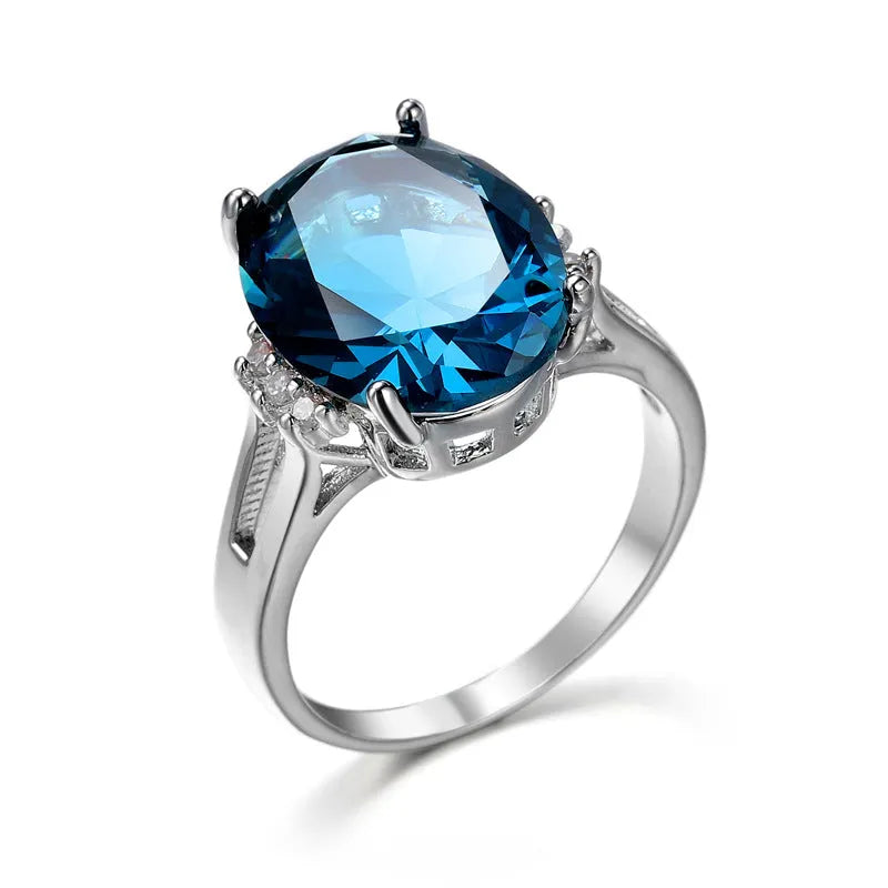 A geometric blue black zircon ring made of copper on a size selection chart showing options 6, 7, 8, 9, and 10.