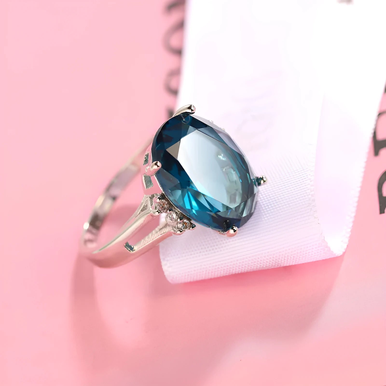 A geometric blue black zircon ring made of copper on a size selection chart showing options 6, 7, 8, 9, and 10.