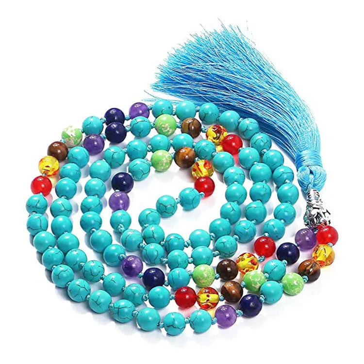 Long geometric agate and gemstone tassel necklace with blue, purple, and multi-coloured beads on a black background.