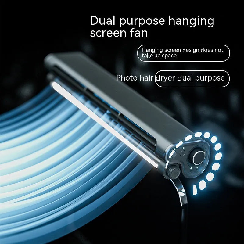 Black bladeless USB fan with light clipped to top of a laptop screen.