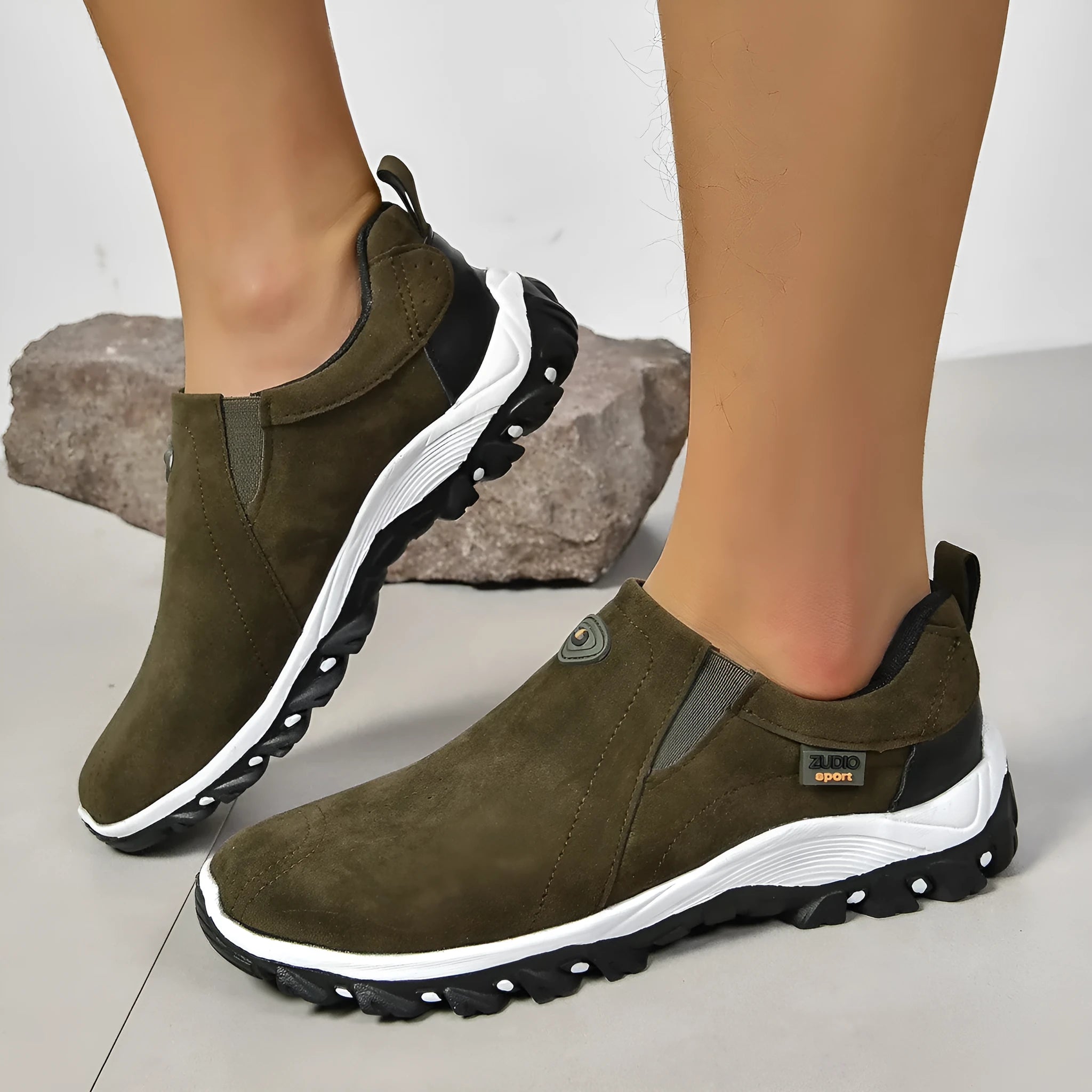 Men's black elastic slip-on shoe covers with round toe and rubber sole, showing PU upper material.